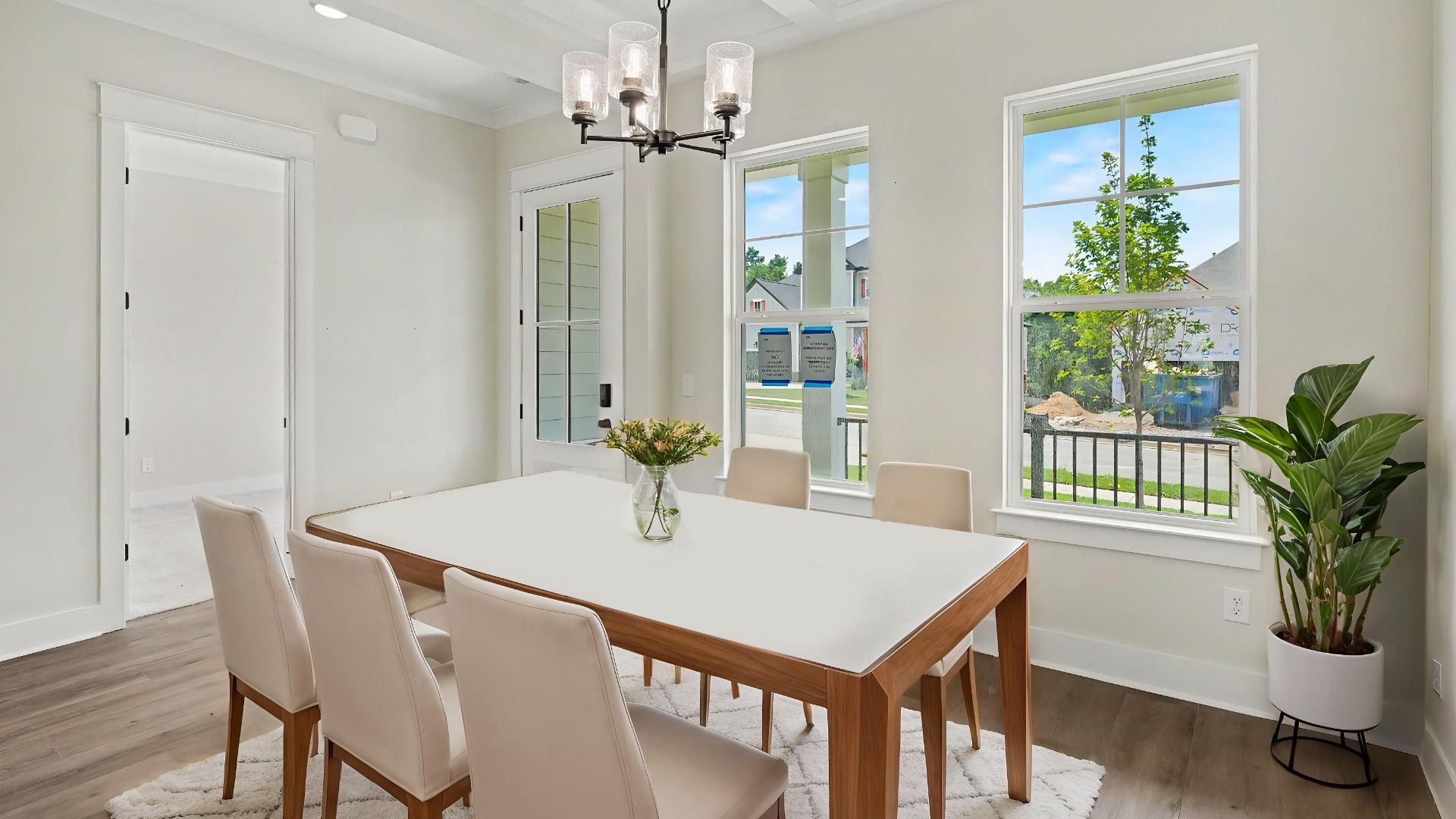 Dining area with windows and hard surface flooring