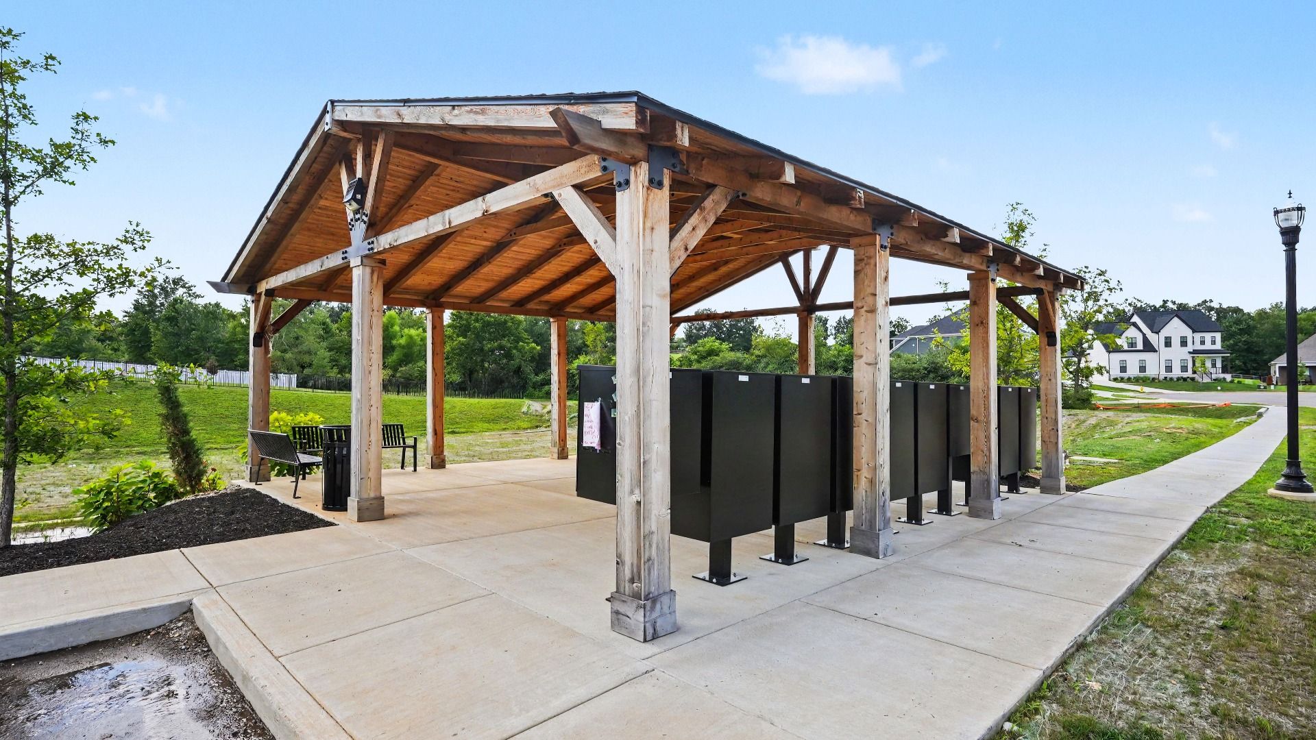 Pavilion over mail kiosk with sidewalks connecting to it