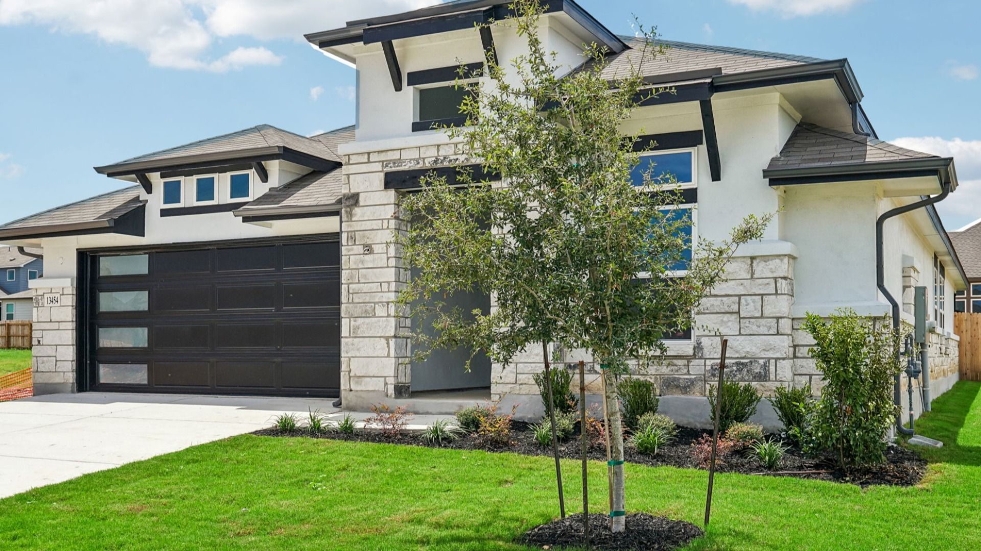 Enjoy beautiful curb appeal with professionally designed landscaping that creates a welcoming first impression