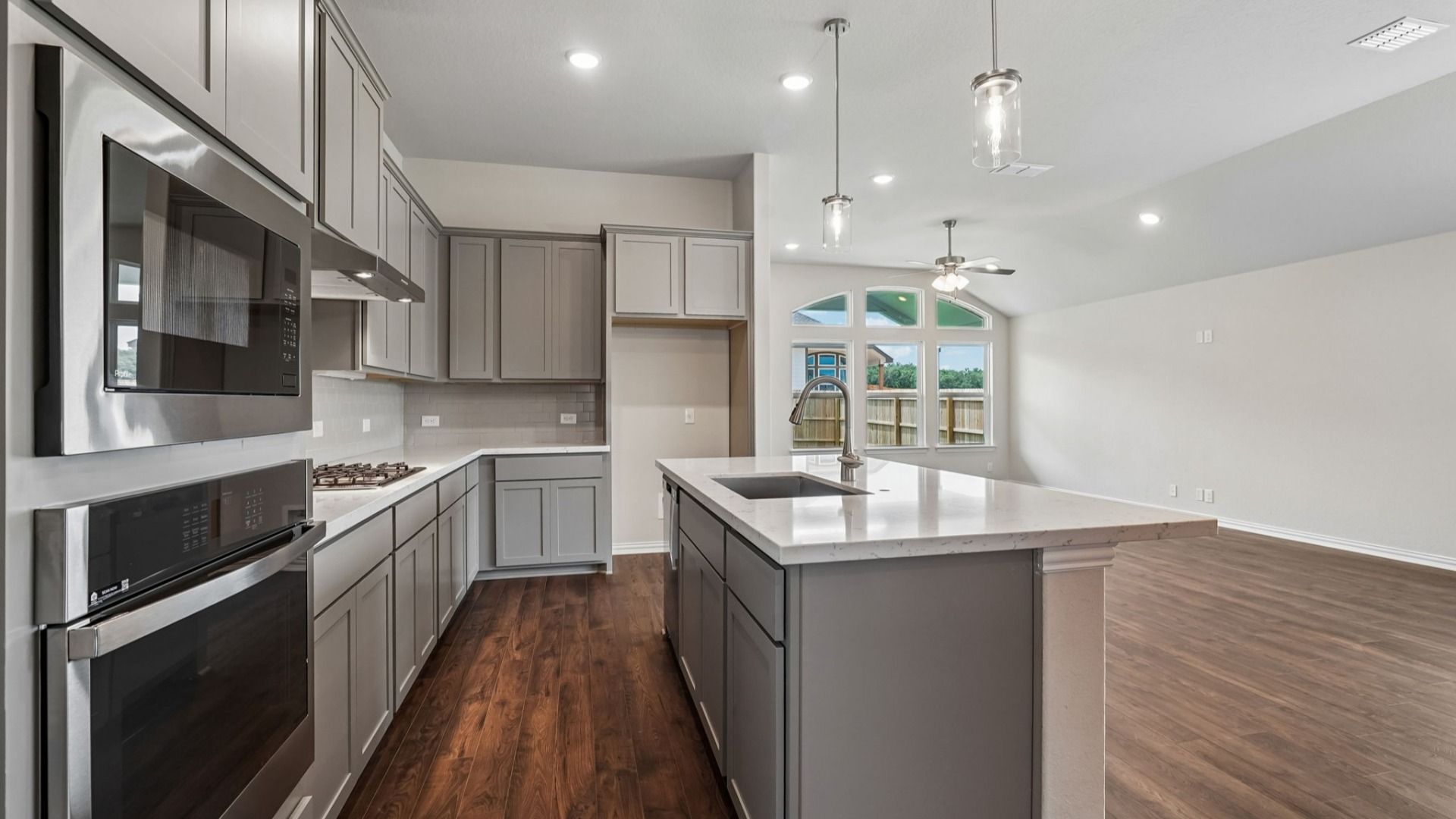 Upgraded kitchen is the heart of the home, featuring a gas cooktop and built-in appliances.