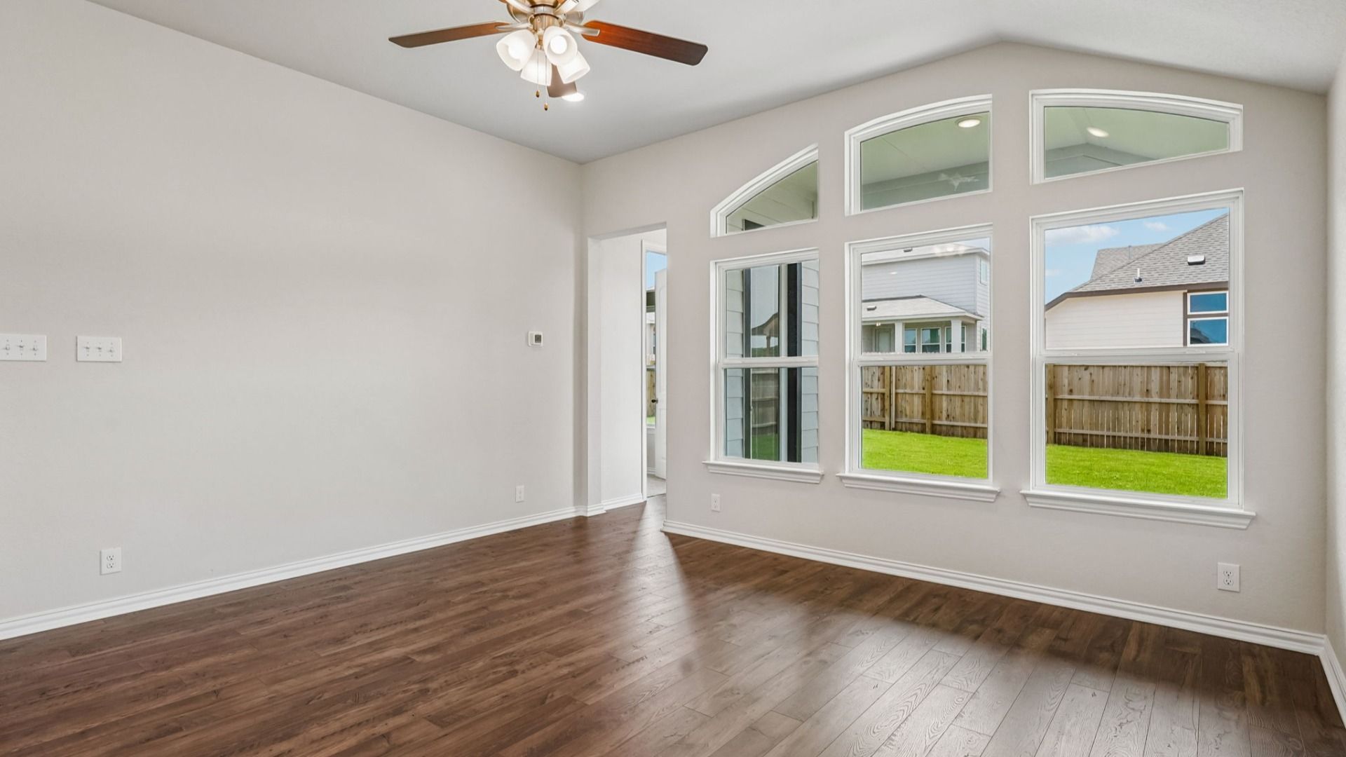 Great room with abundant windows fills the home with natural light and flows seamlessly into the casual dining area.