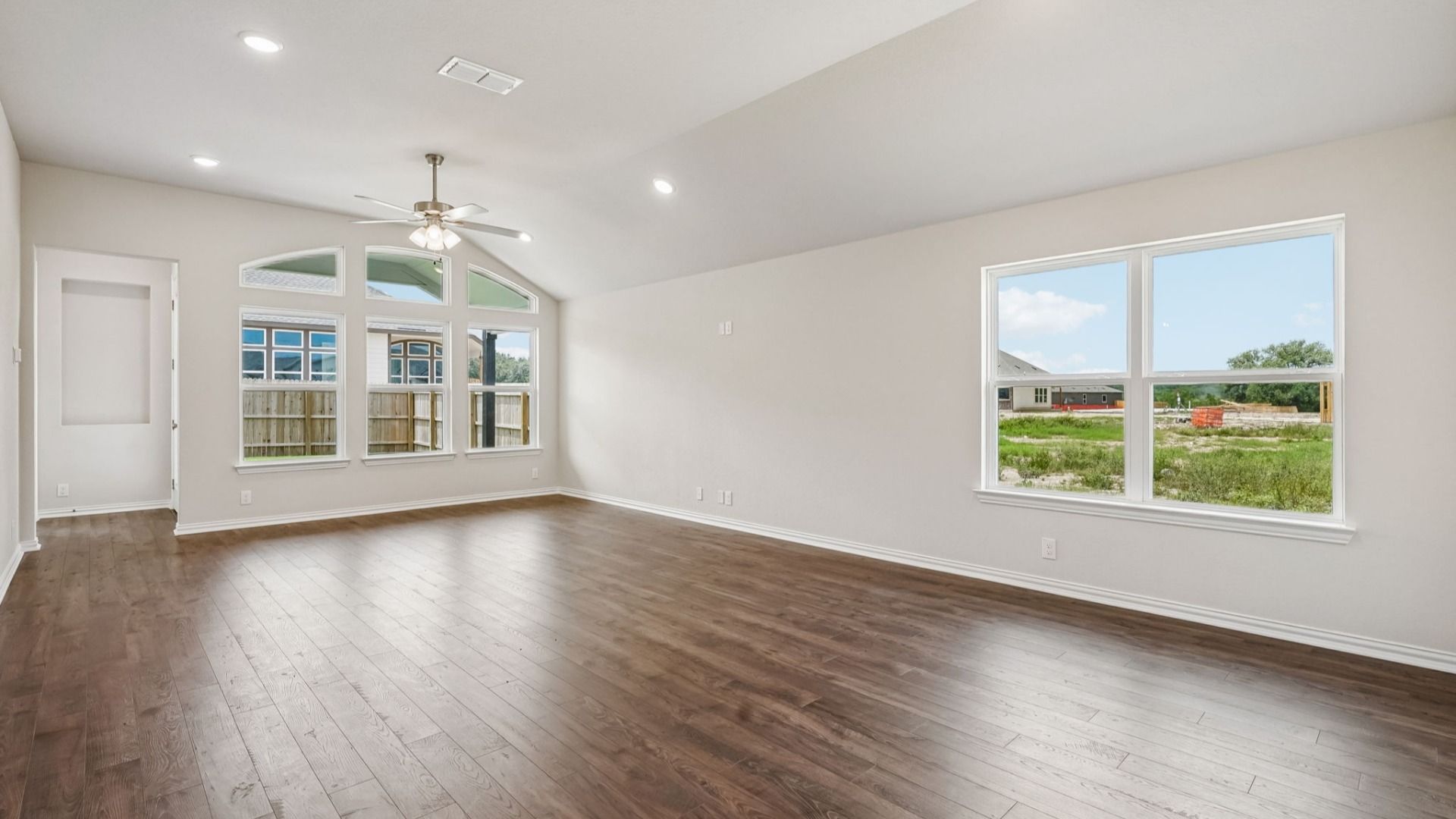 Great room with abundant windows fills the home with natural light and flows seamlessly into the casual dining area.