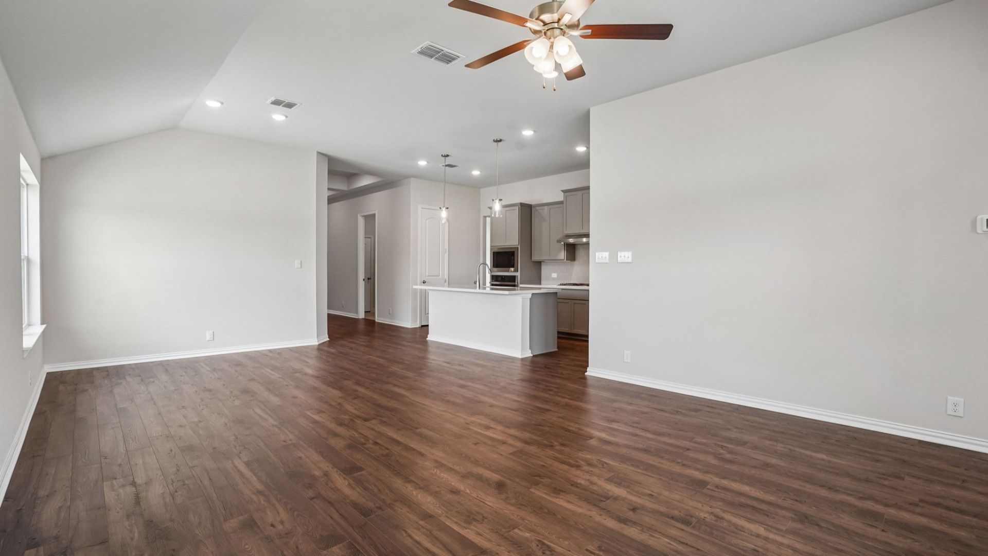 Great room with abundant windows fills the home with natural light and flows seamlessly into the casual dining area.