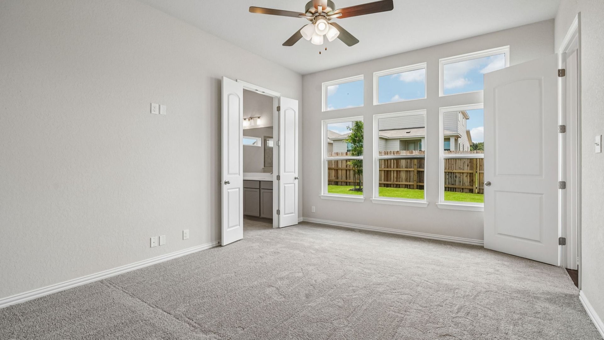 Spacious owner's suite features transom windows that bring in additional natural light.