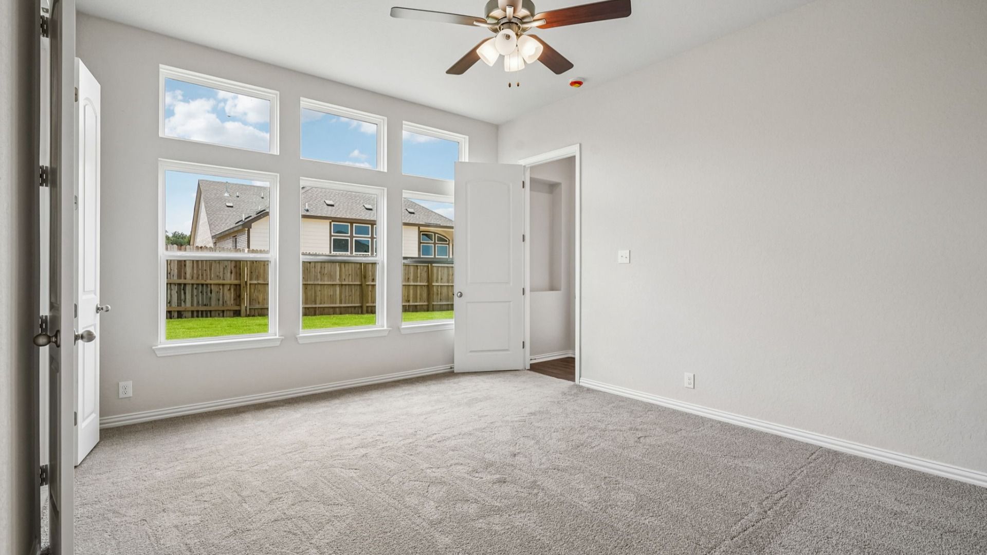 Spacious owner's suite features transom windows that bring in additional natural light.