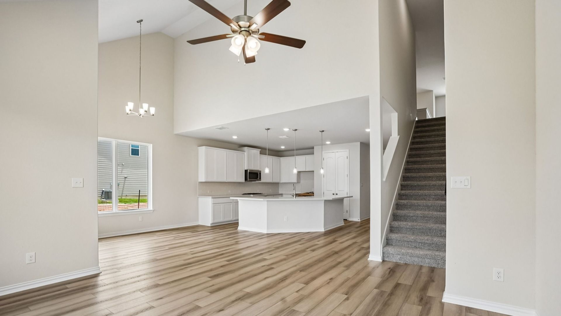 Great Room opens to the Casual Dining Area, Staircase, and the Kitchen