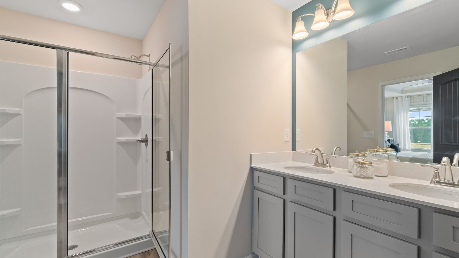 Primary Bathroom with dual vanity and walk-in shower