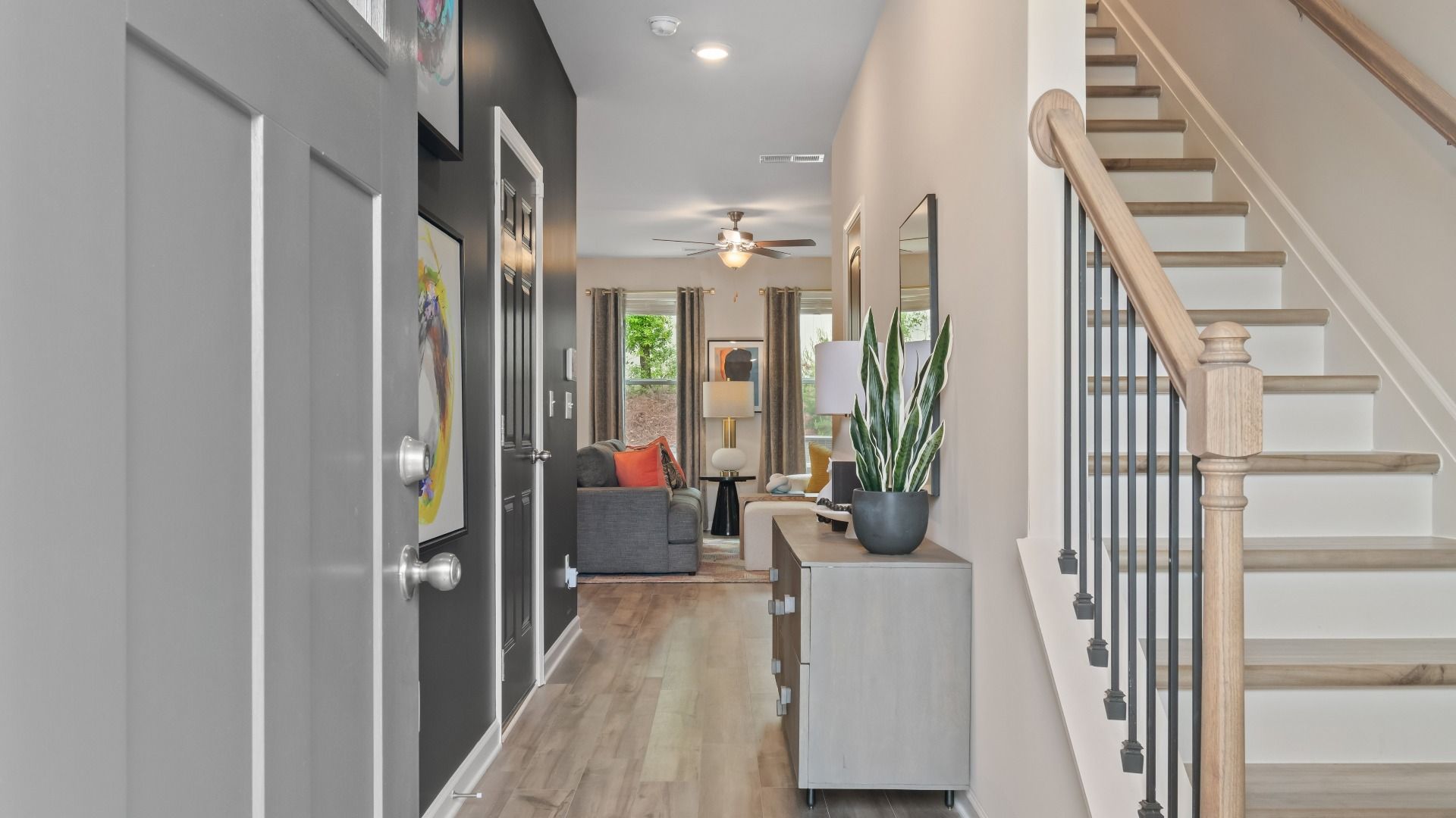 Front door entry area with stairs to second floor and hall to main level