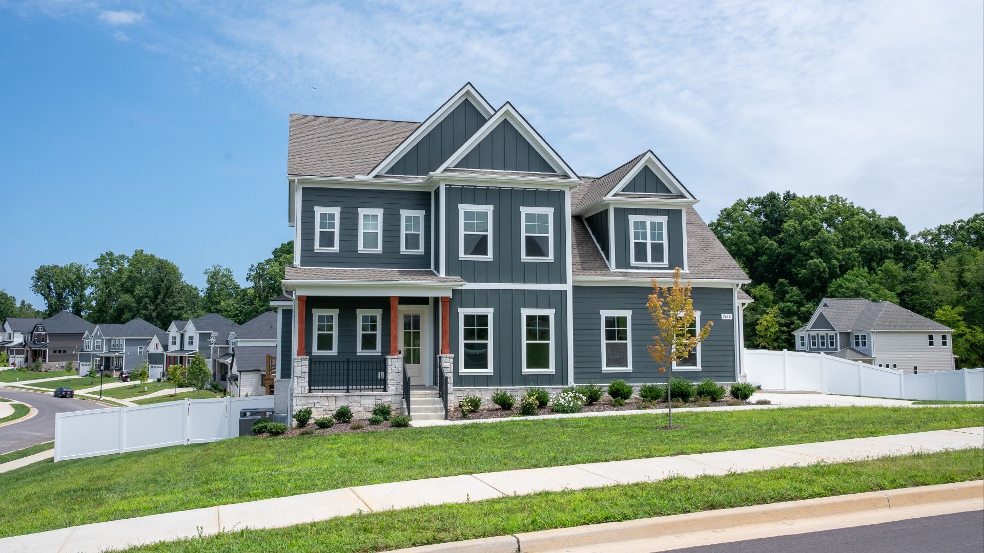 Stunning exterior on corner lot, with side entry 3-car garage at Richvale Estates in Fairview, TN.