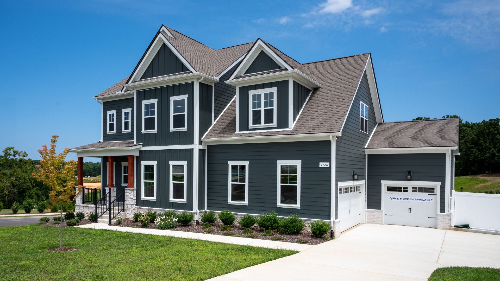 Stunning exterior on corner lot, with side entry 3-car garage at Richvale Estates in Fairview, TN.