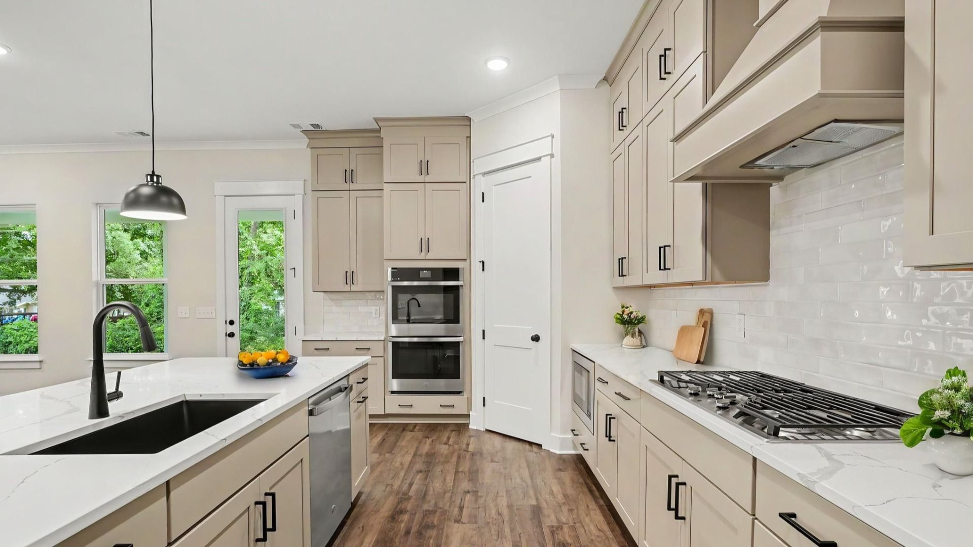 Virtual Staging of kitchen with quartz countertops, tile backsplash, and upgraded kitchen