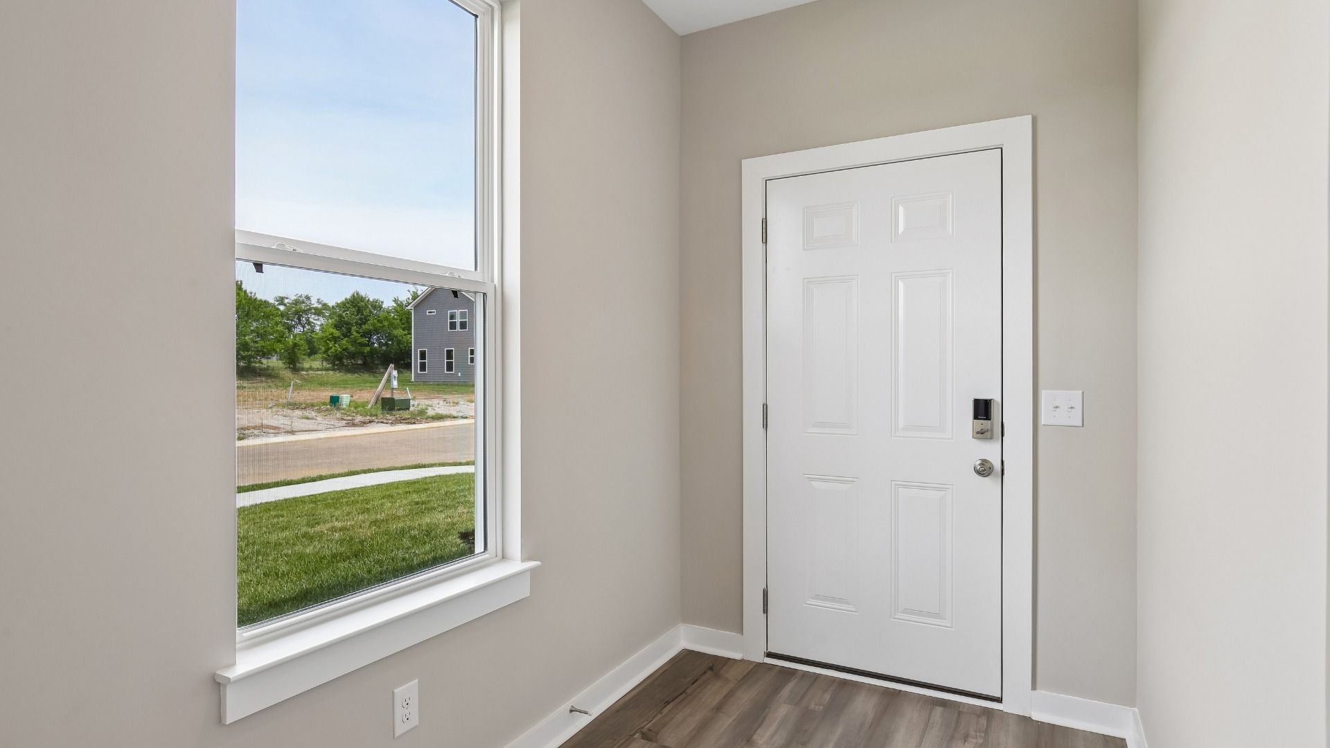 Front Door to home with nearby window