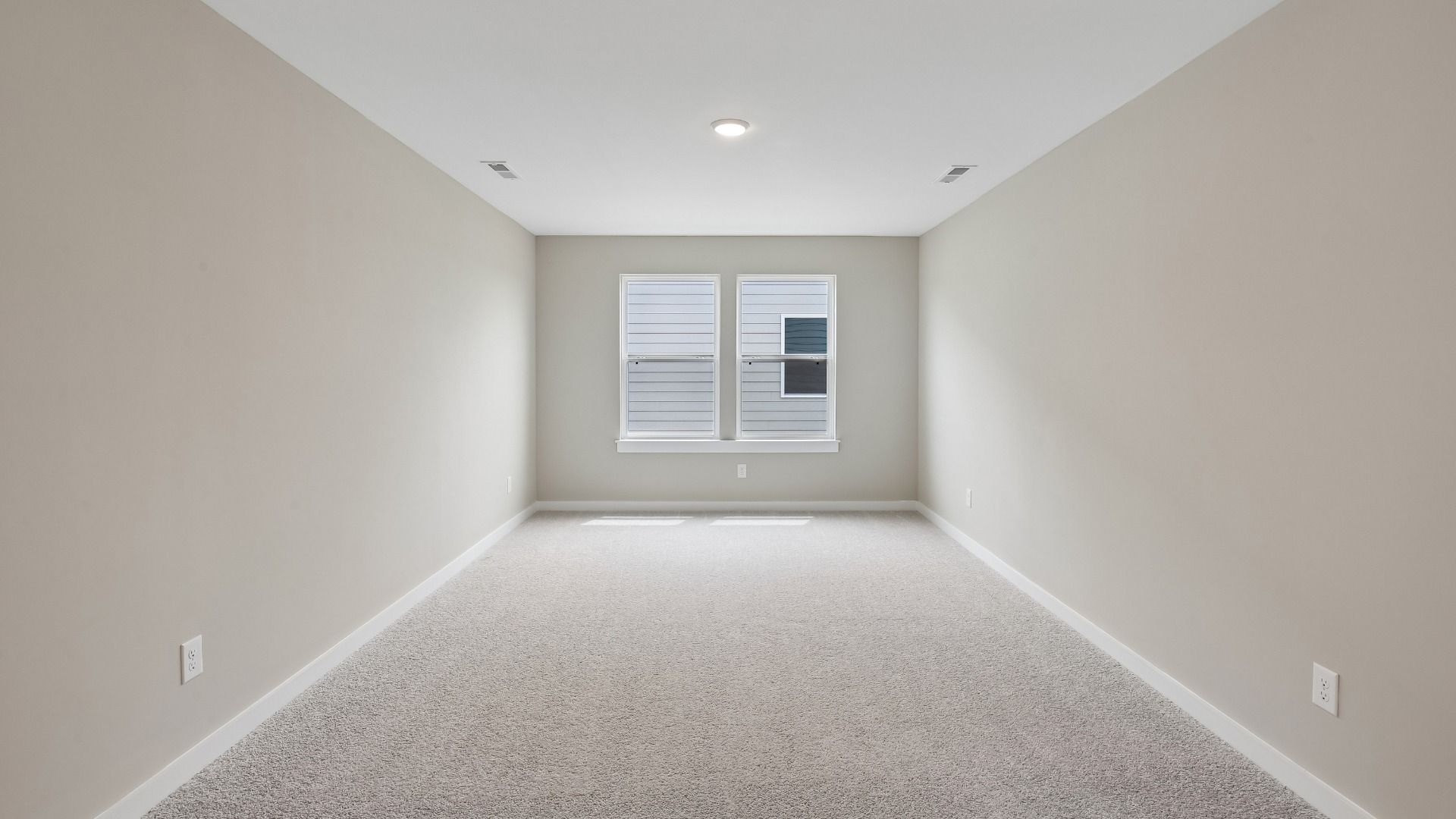 Second Floor Loft area with windows and carpet