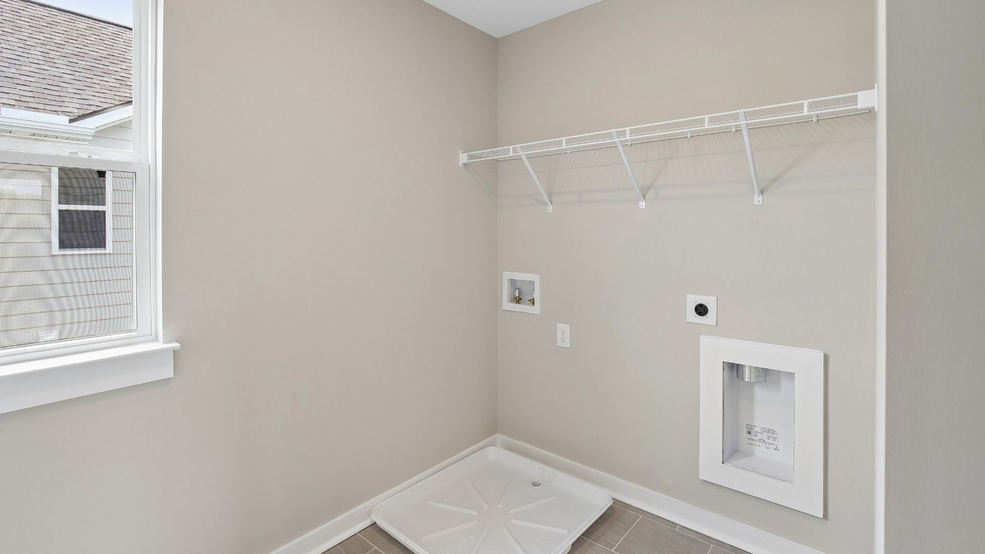 Dedicated Laundry Room with Shelving