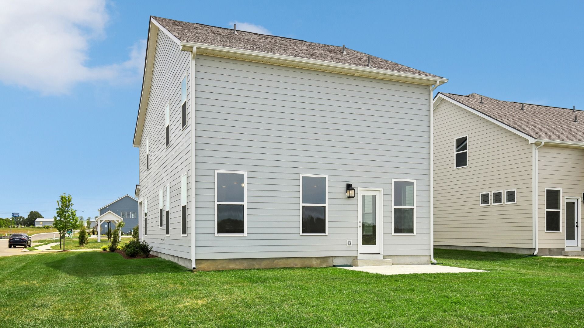 Large Backyard of home with small back patio