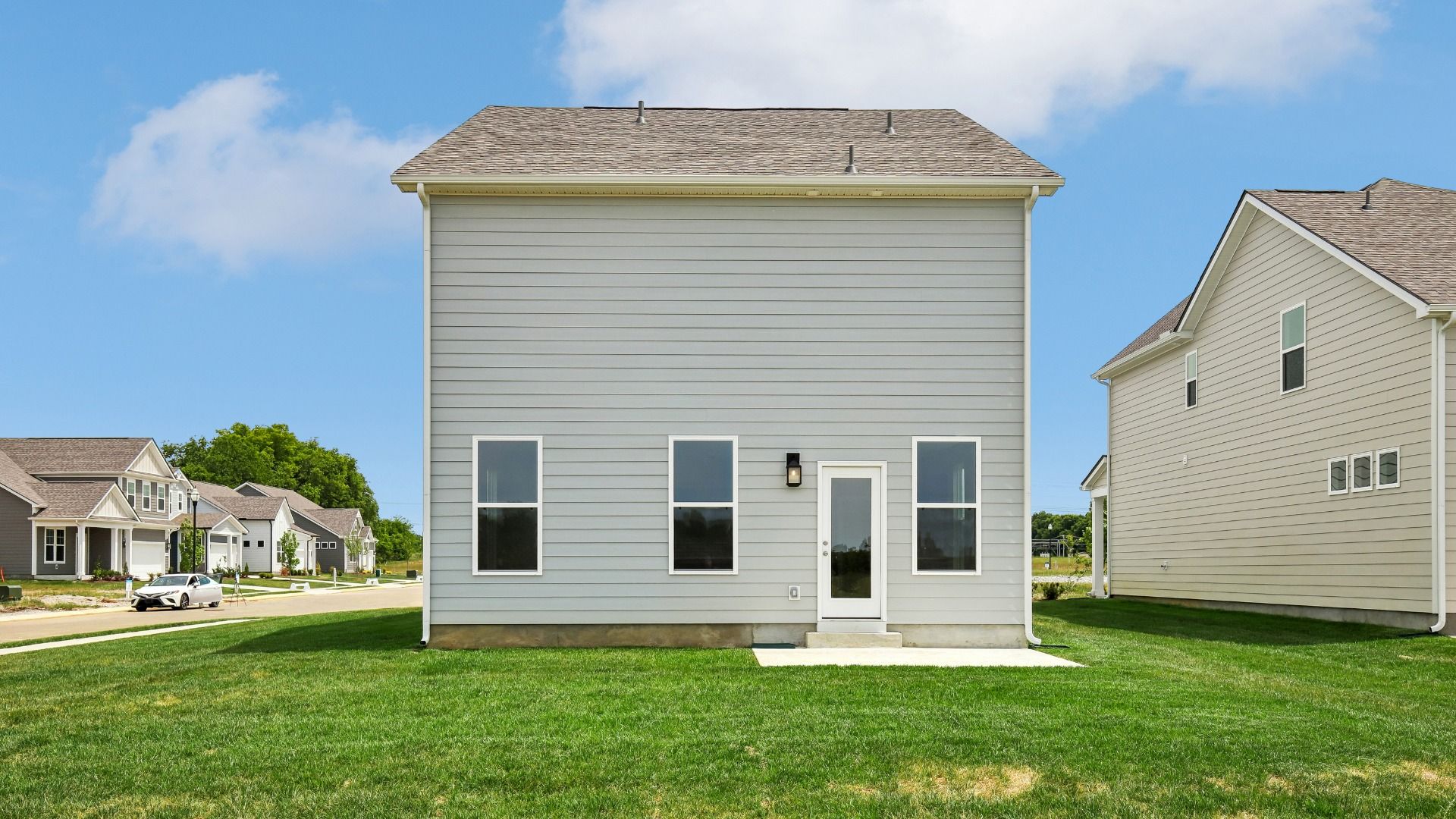 Large Backyard of home with small back patio