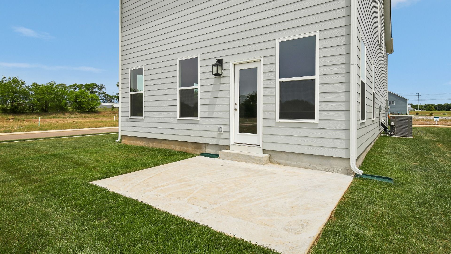 Large Backyard of home with small back patio