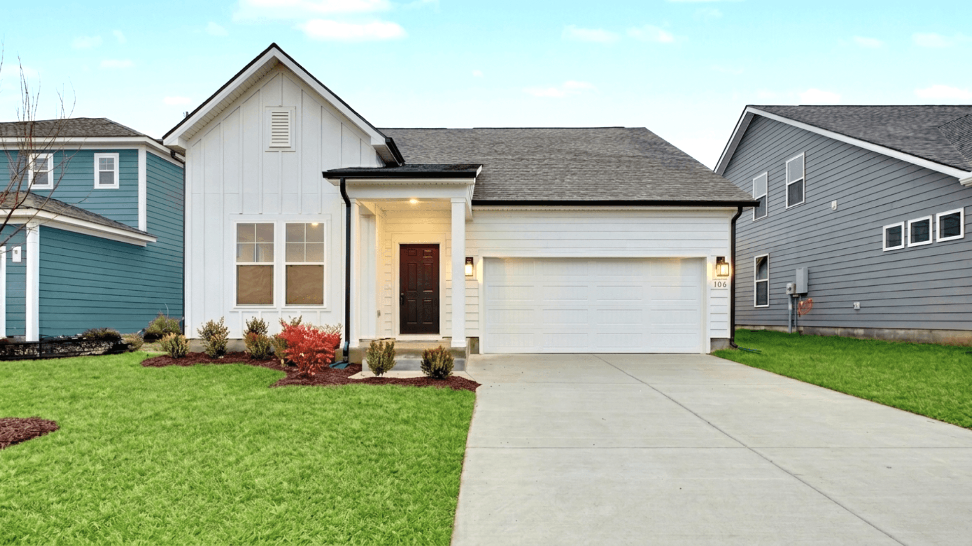 Greenwich Plan exterior with white siding and 2-car garage