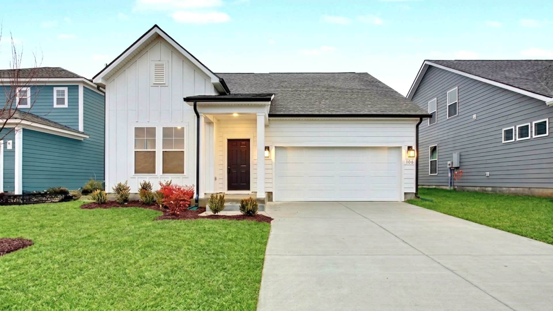 Greenwich Plan exterior with white siding and 2-car garage