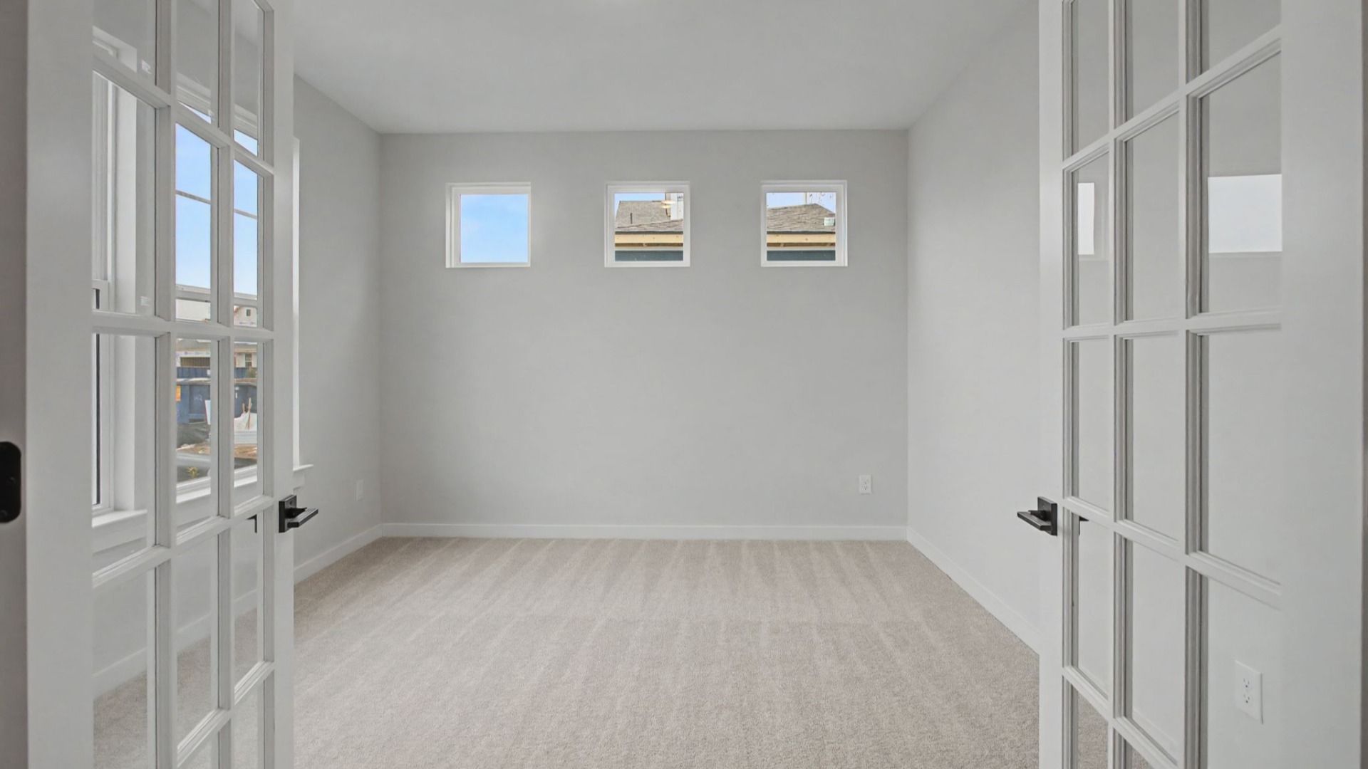 Dedicated study with glass insert French doors and bright windows
