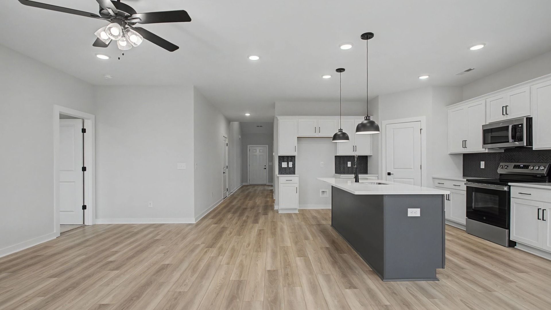 Open-concept first floor with living room near the kitchen and dining area
