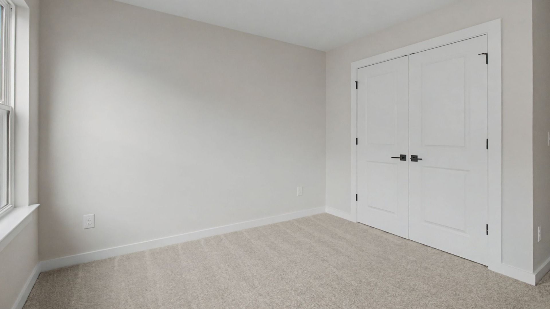 Carpeted Secondary bedroom with closet