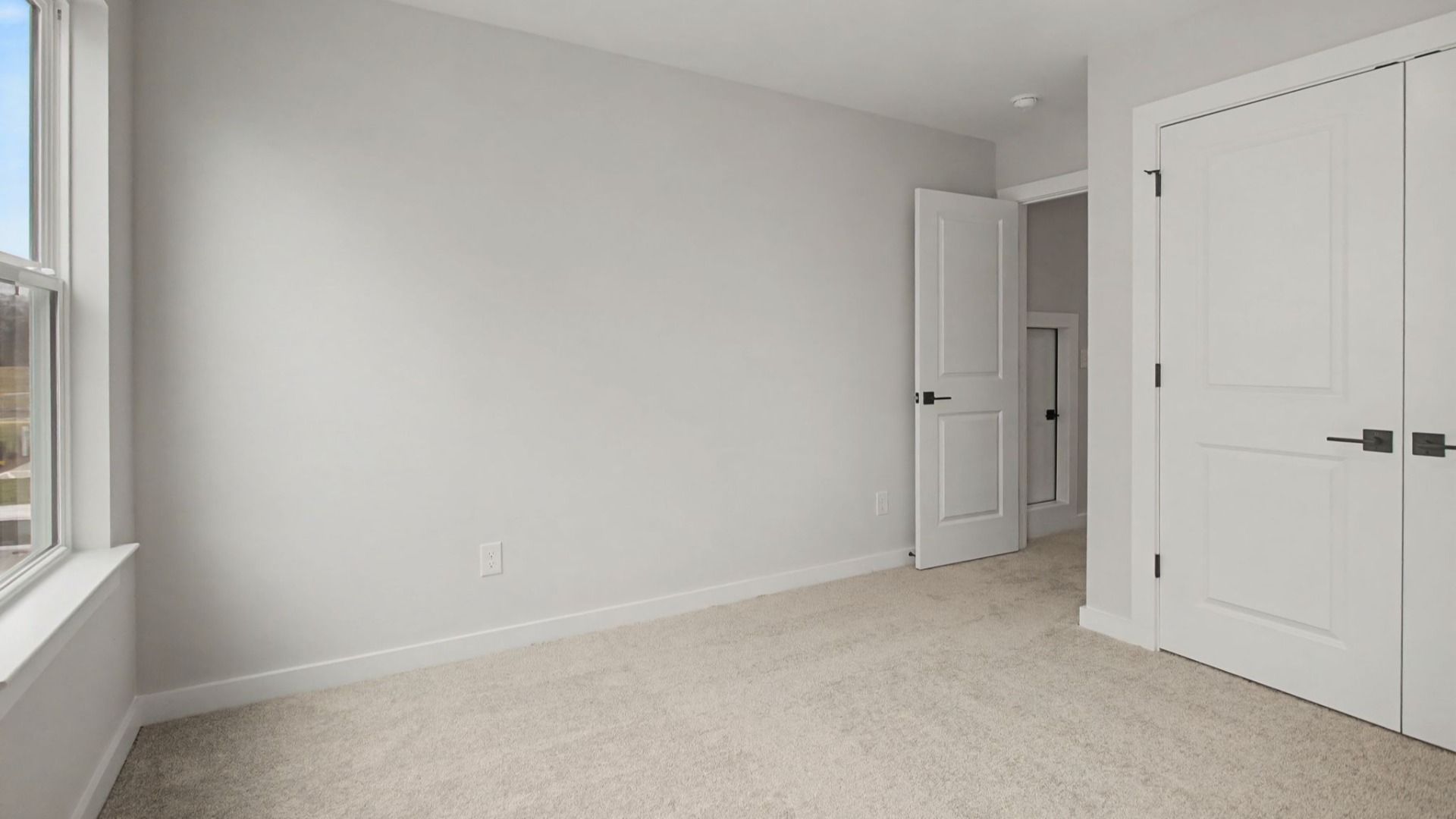 Second floor bedroom with closet and storage area