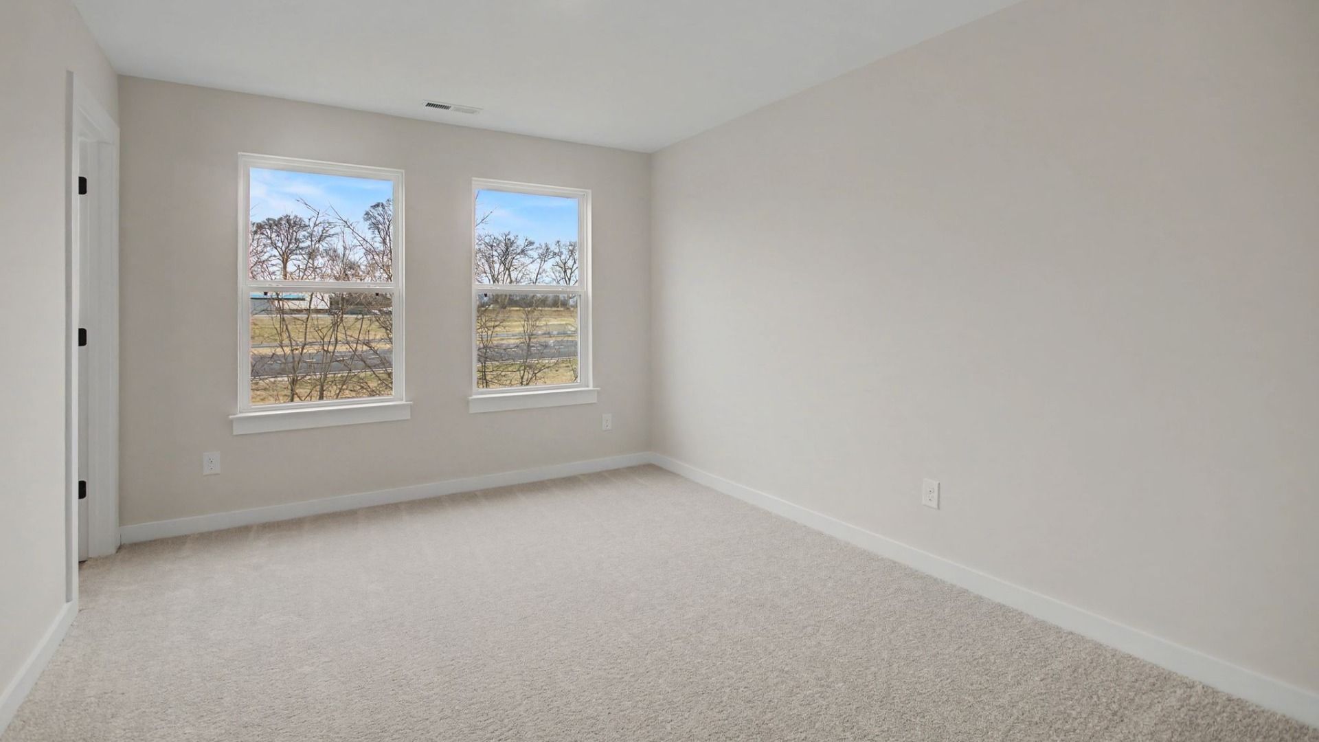 Larger secondary bedroom with walk-in closet and en-suite bathroom