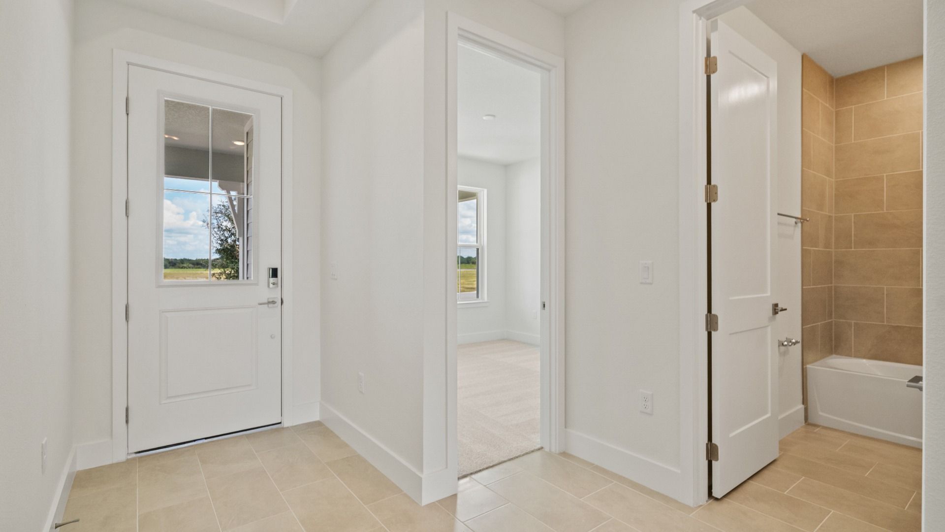Interior Entry and Guest Bath in the Buttonwood Floor Plan by DRB Homes in Ardisia Park in New Smyrna Beach