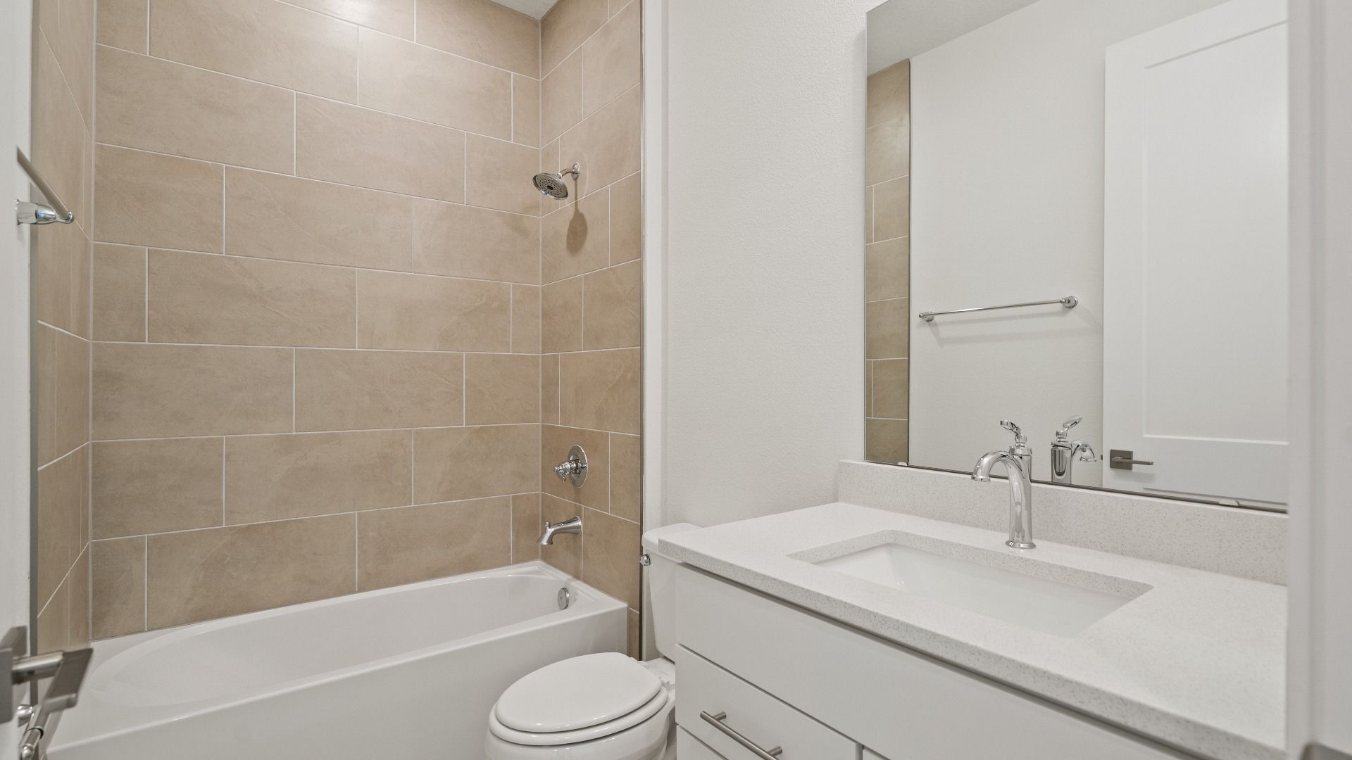Secondary Bathroom in the Buttonwood Floor Plan by DRB Homes in Ardisia Park in New Smyrna Beach