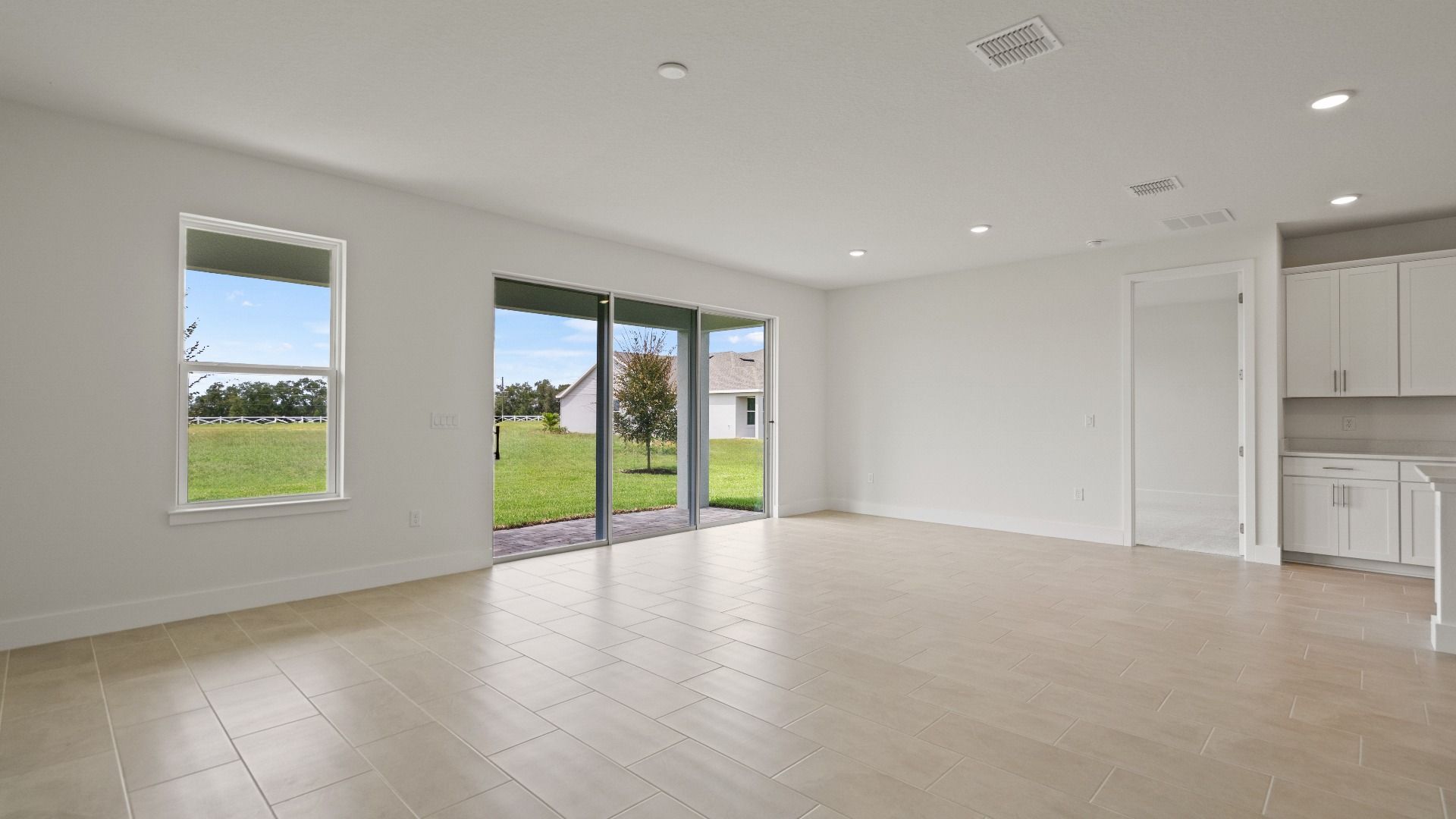 Living Area in the Buttonwood Floor Plan by DRB Homes in Ardisia Park in New Smyrna Beach