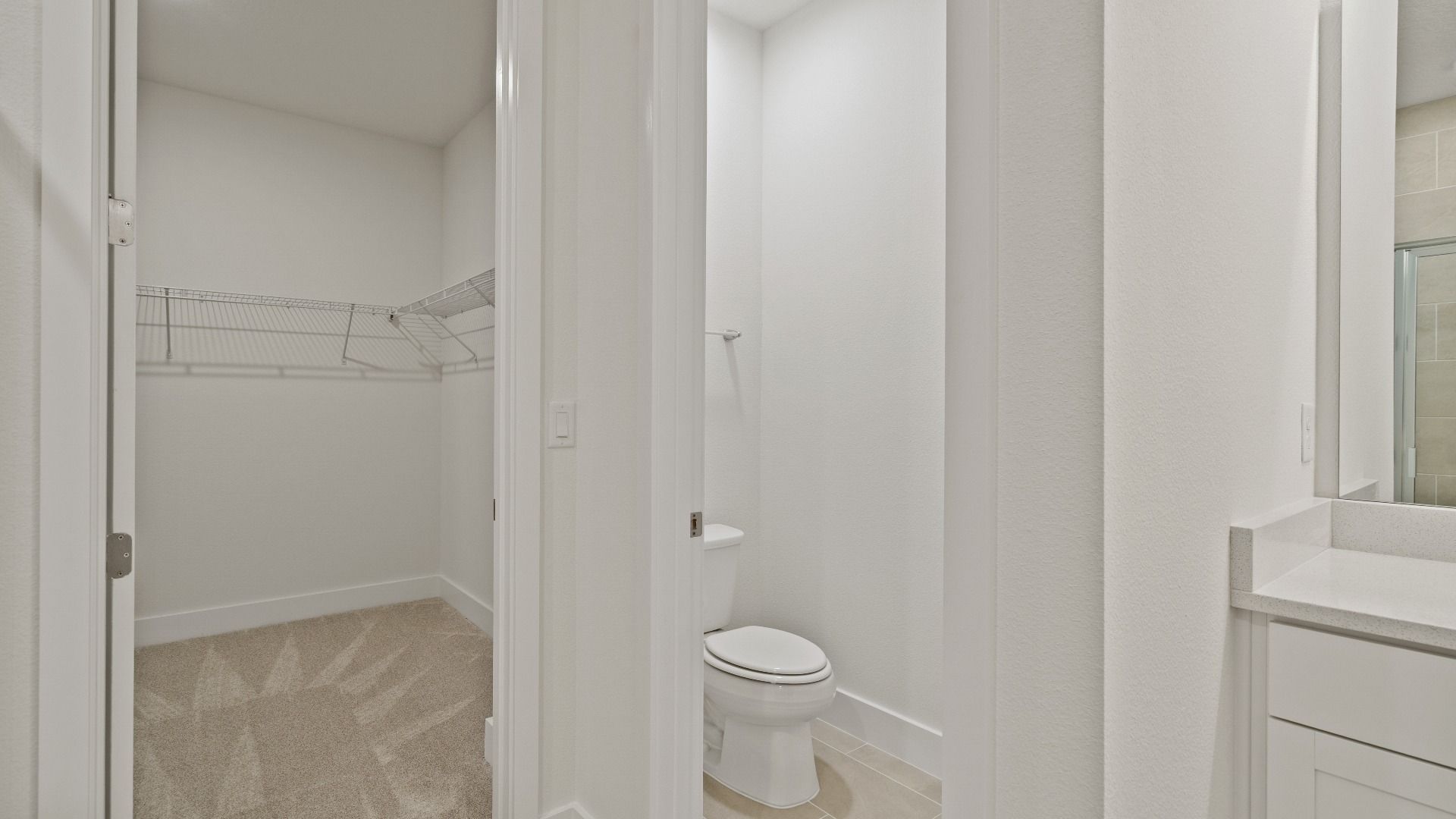 Primary En Suite Bath and Spacious Walk-in Closet in the Buttonwood Floor Plan by DRB Homes Ardisia Park in New Smyrna Beach