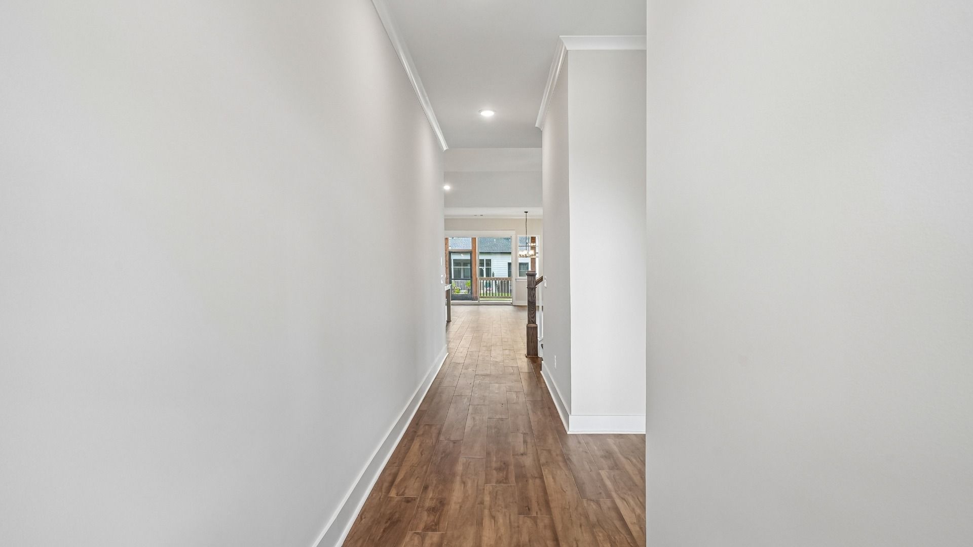 Entry hallway to home with bedroom on the right