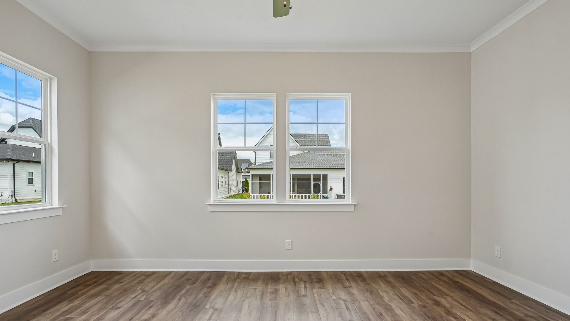 Primary Bedroom with ceiling fan and hard surface flooring
