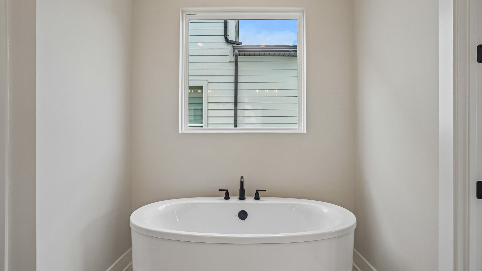 Freestanding tub in primary bathroom