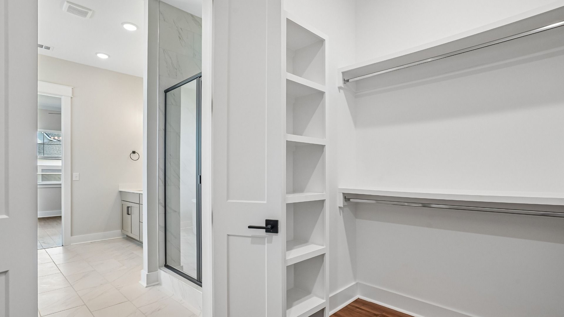 Primary Walk-in Closet with built-in MDF shelving