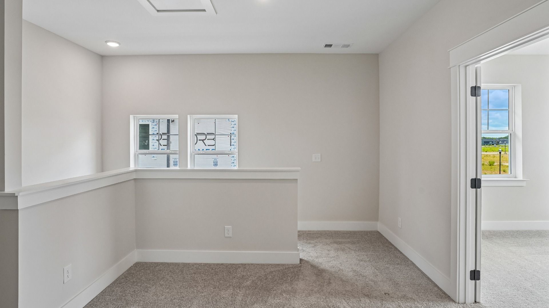 Second floor stair landing with nearby guest suite