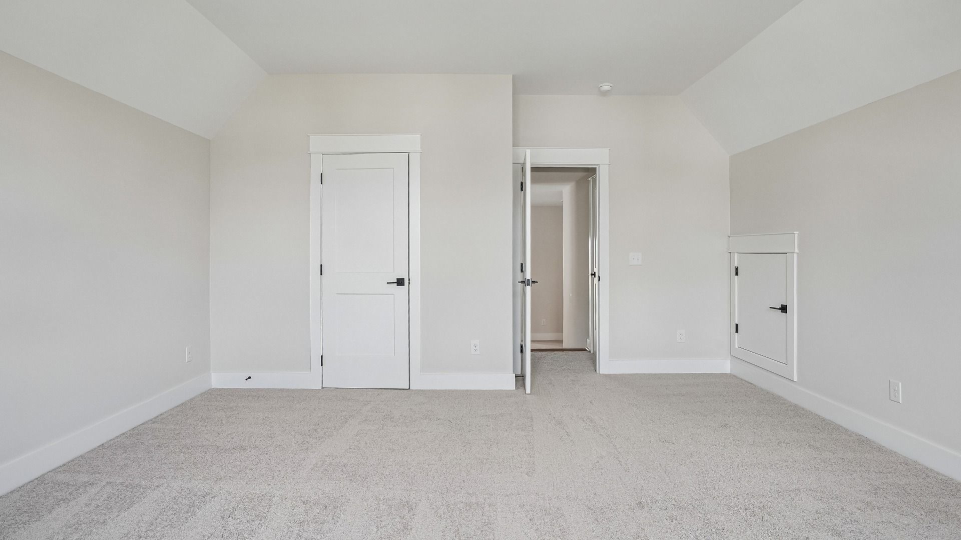 Guest bedroom with vaulted ceiling