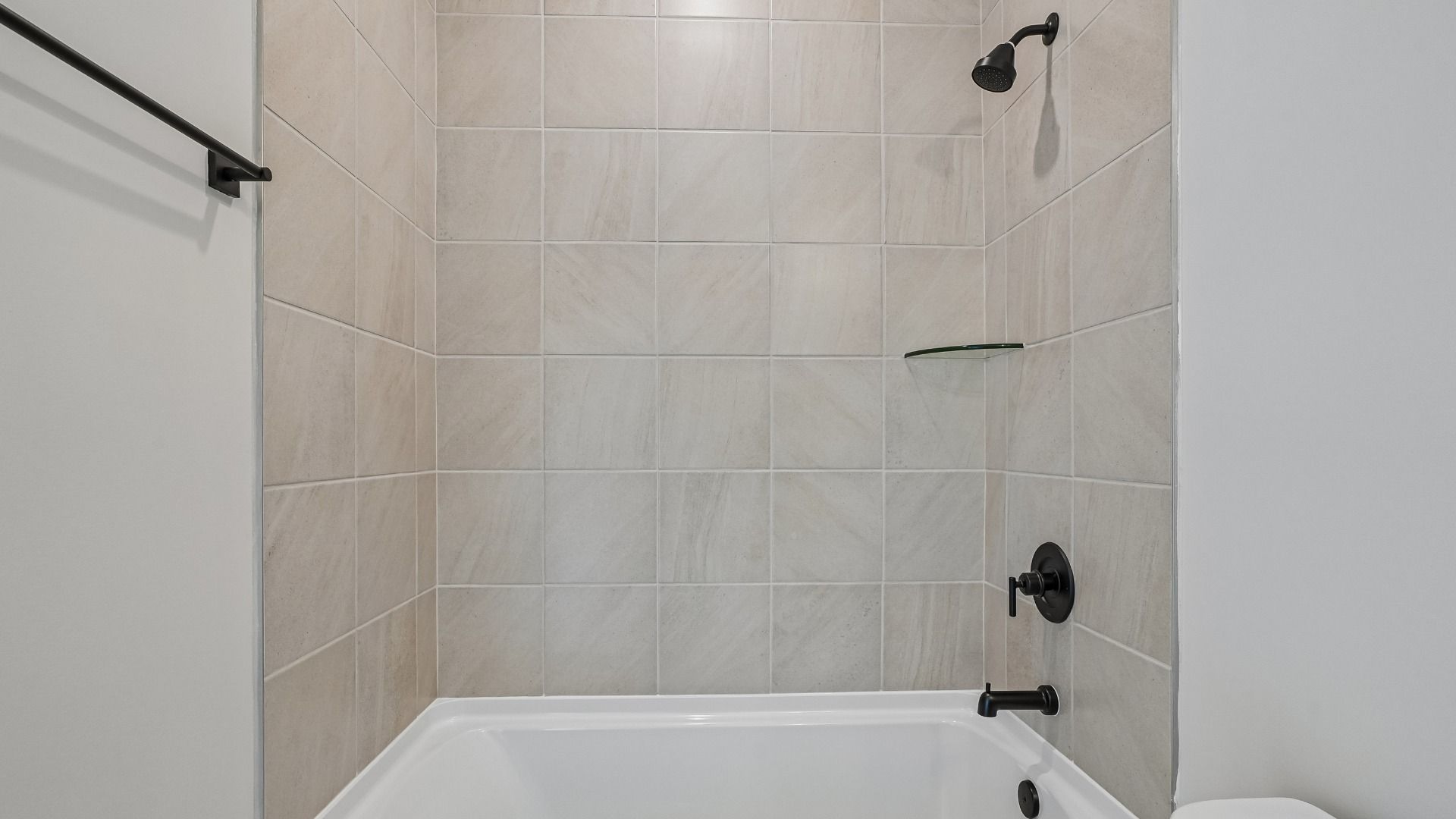 Private guest bathroom with tiled shower