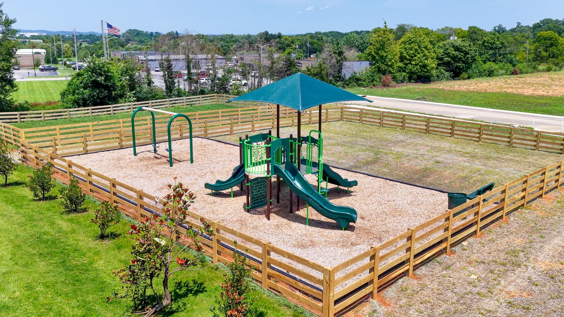 On-site Community Playground and Swing Set with grass area