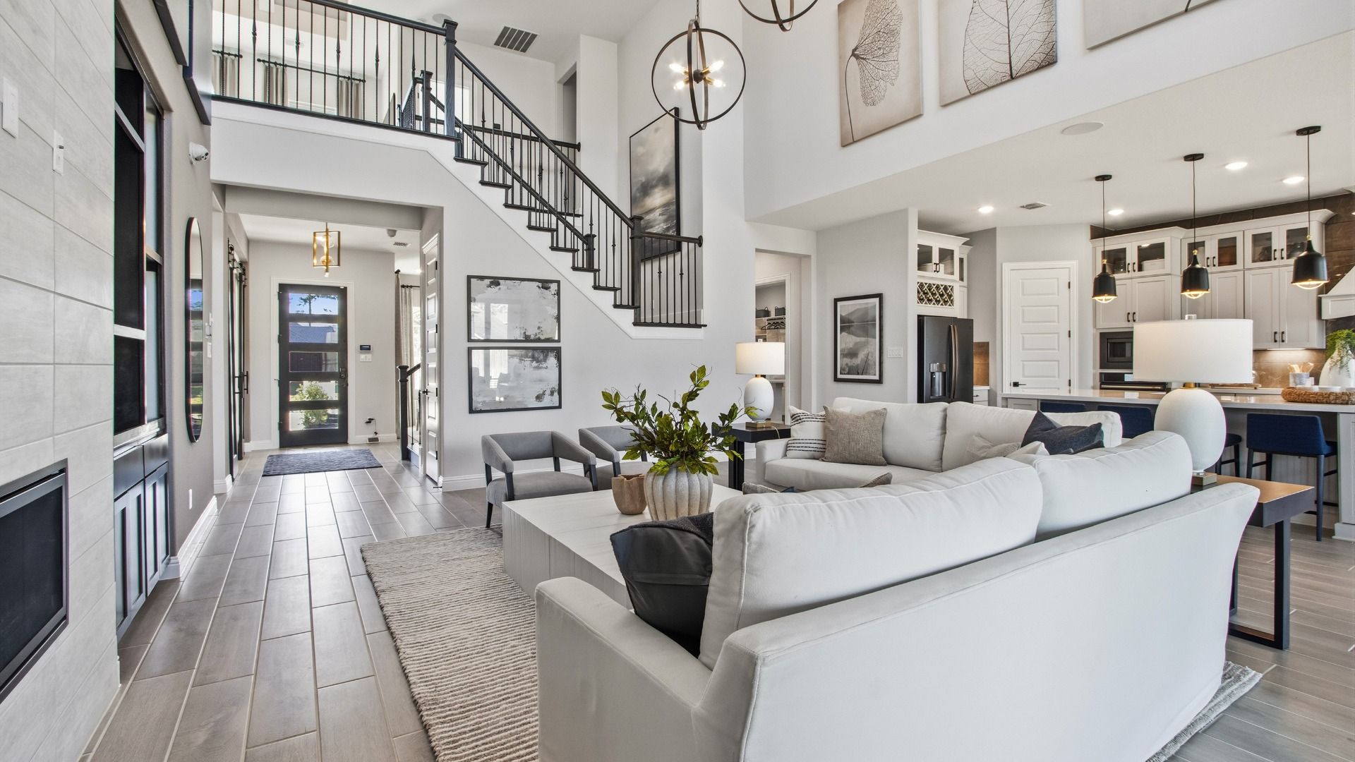 Experience luxury with high ceilings, sleek fireplace, and elegant decor in Mostyn Manor Reserve.