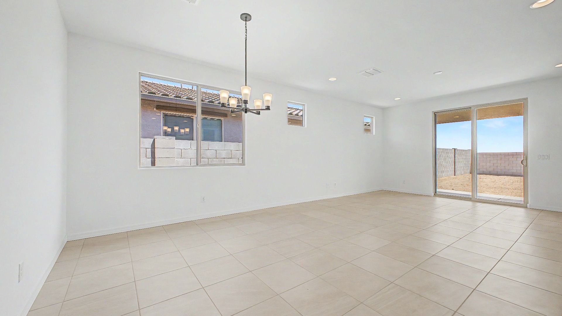 Spacious open dining and great room in this quick move-in home by DRB Homes, 32371 N 123rd Dr, Peoria, AZ.