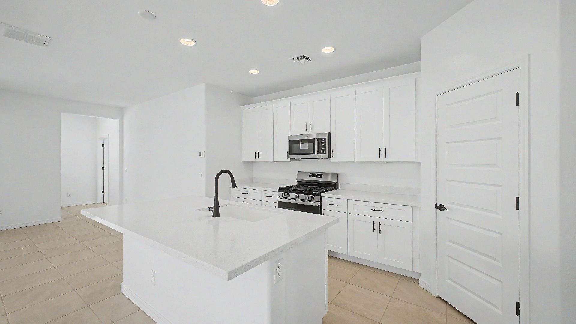 Bright open kitchen in this quick move-in home by DRB Homes at Saguaro Hills at Vistancia, 32371 N 123rd Dr, Peoria, AZ.