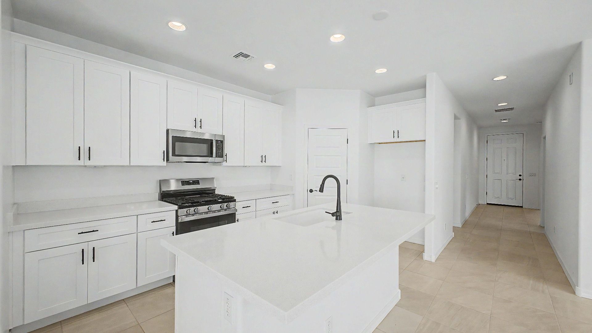 Gourmet kitchen side view in this quick move-in home by DRB Homes at Saguaro Hills at Vistancia, 32371 N 123rd Dr, Peoria, AZ