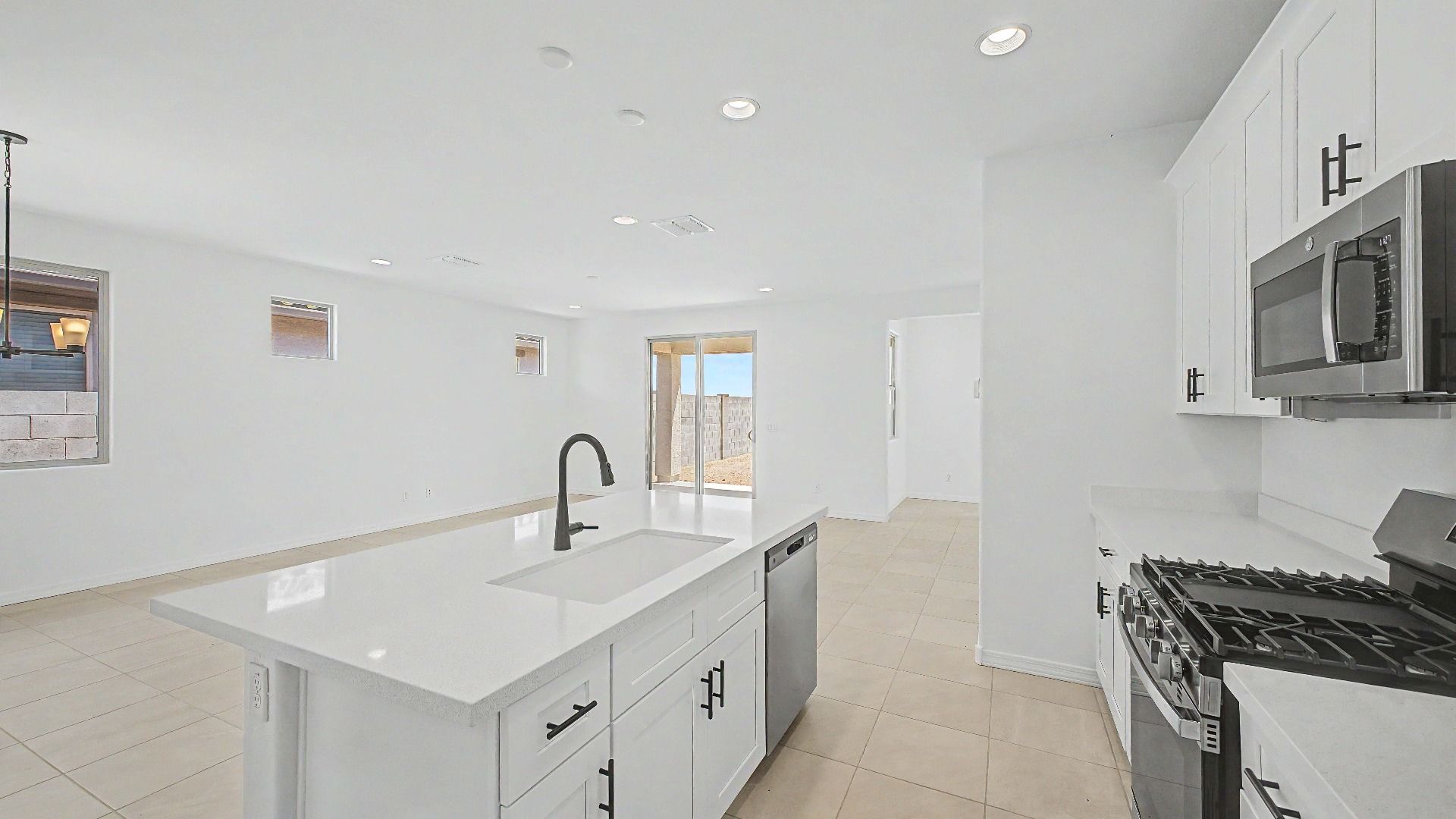 Stainless steel kitchen appliances in this quick move-in home by DRB Homes at Saguaro Hills at Vistancia, 32371 N 123rd Dr.
