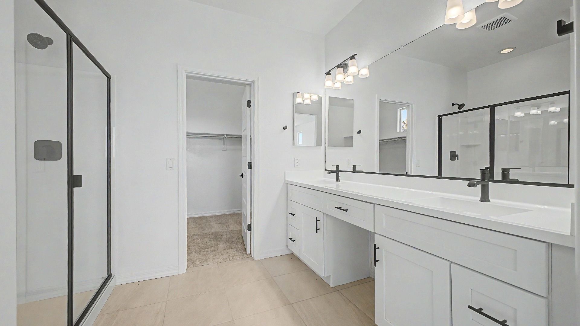 Primary bathroom shower & double vanity in this quick move-in home at Saguaro Hills at Vistancia, 32371 N 123rd Dr.