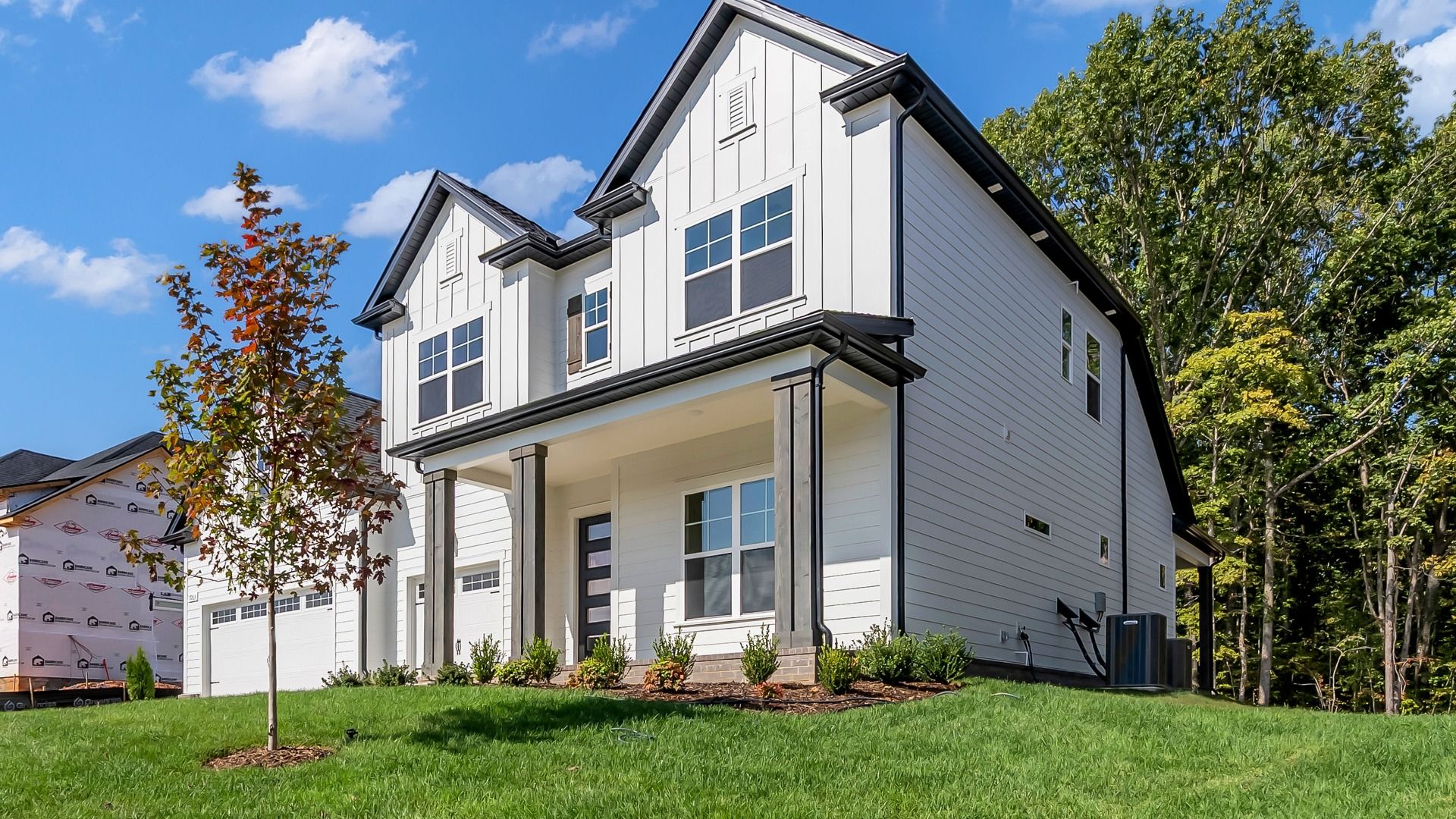 Front Exterior of Home with 3-car garage and overed front porch (Representative of completed home)