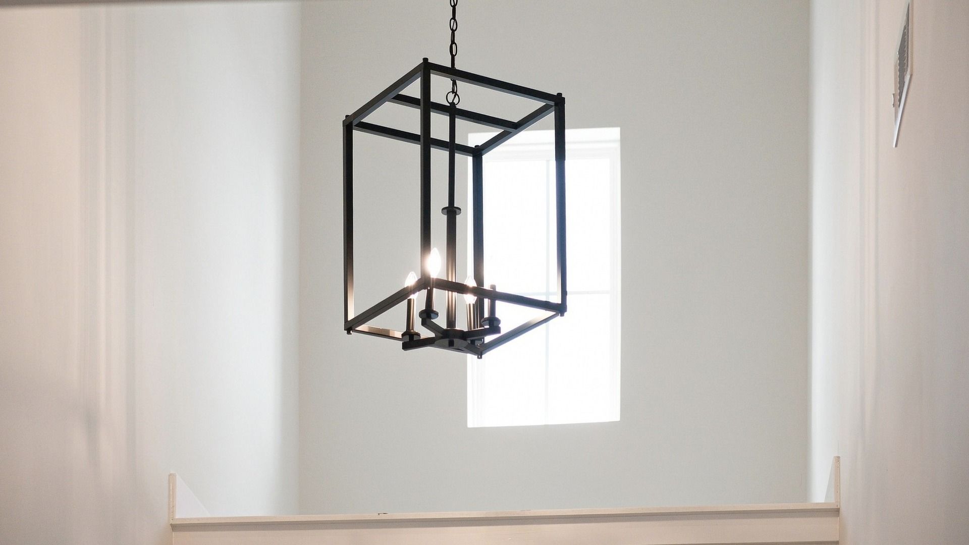 Closeup of entry way hanging light design.