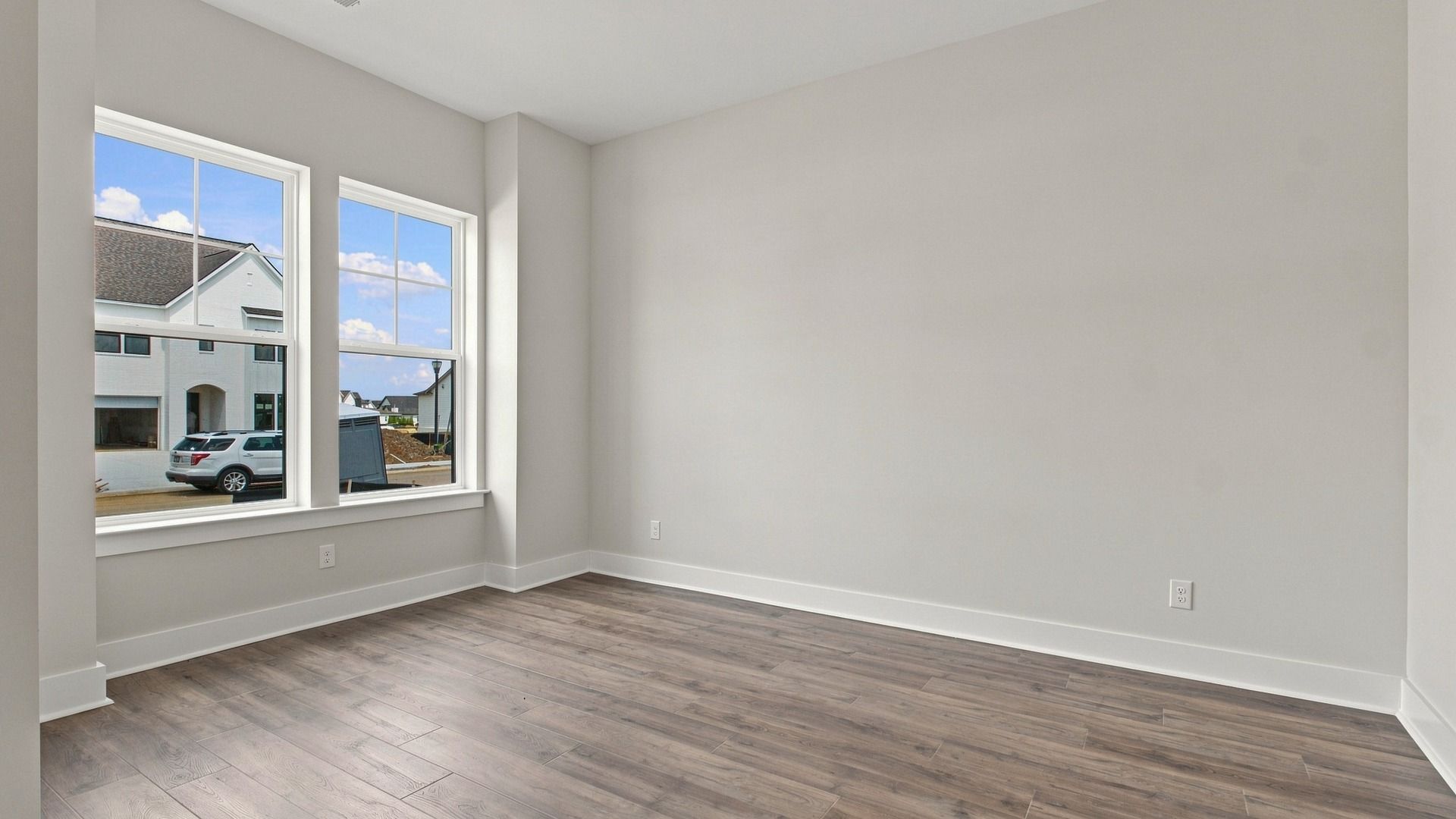 Two sizable windows allow for natural light into the living space.