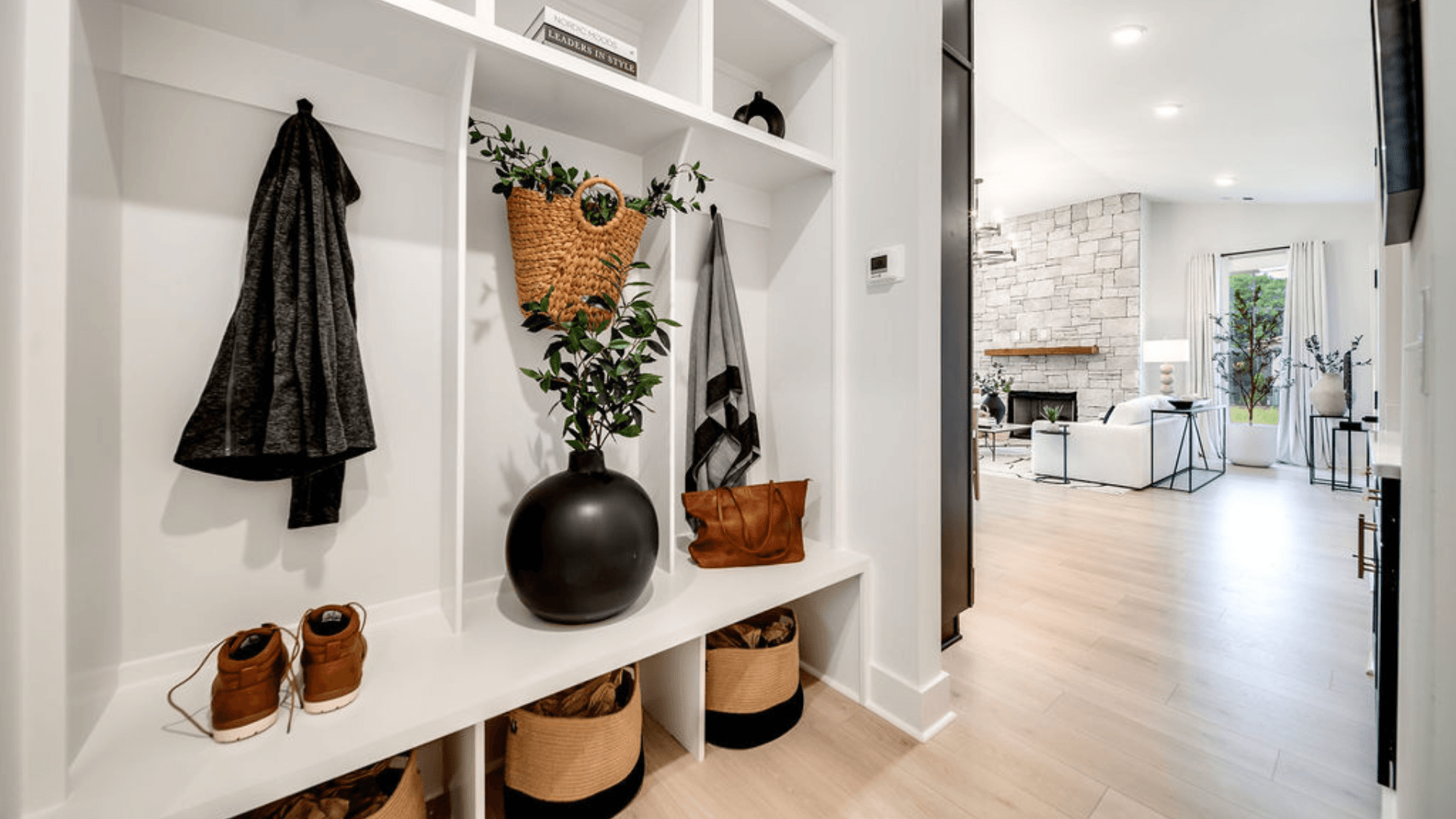 Convenient mudroom storage option next to living area.